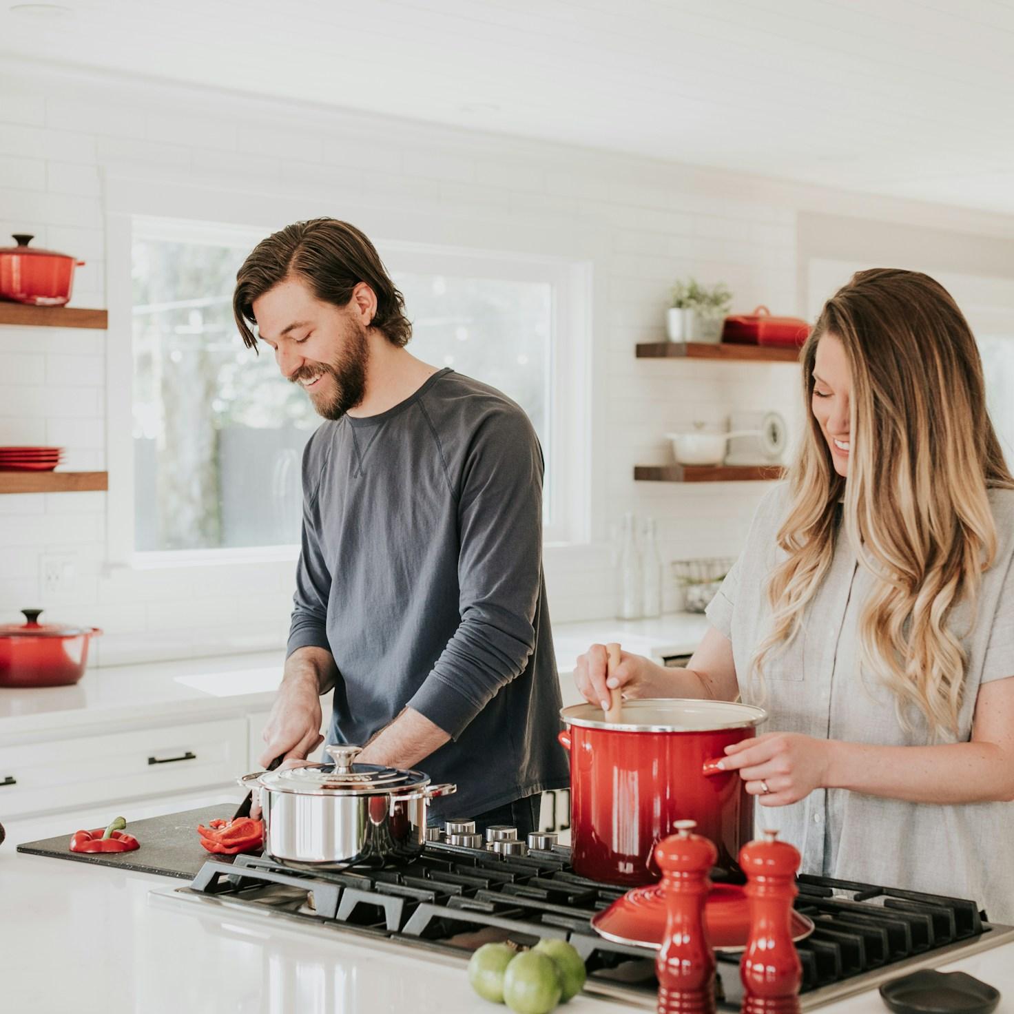 Community members collaborating in a modern kitchen space, sharing recipes and cooking techniques